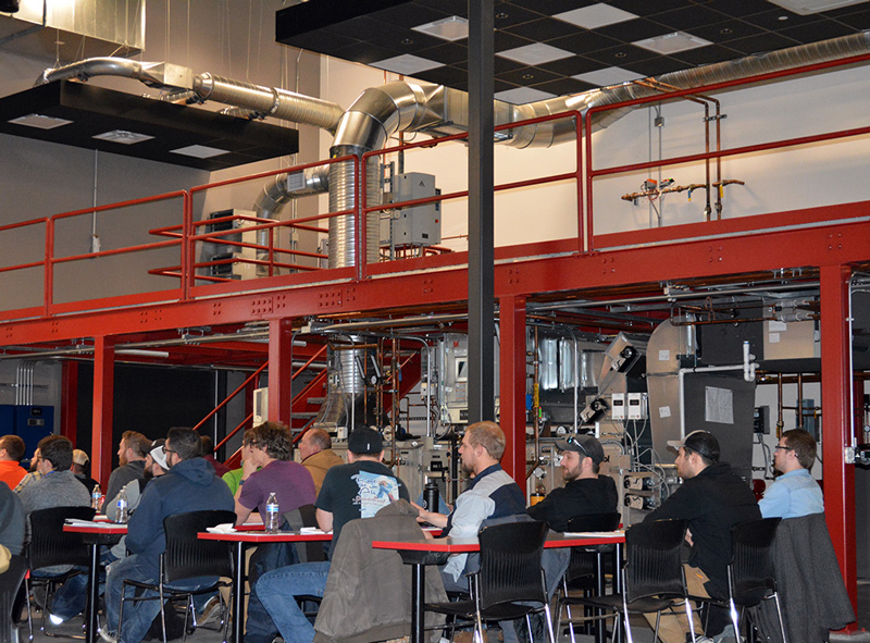 technicians learning new repair techniques at training facility