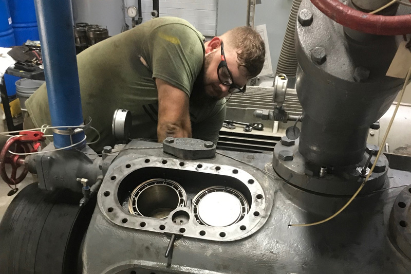 technician working on refrigeration system