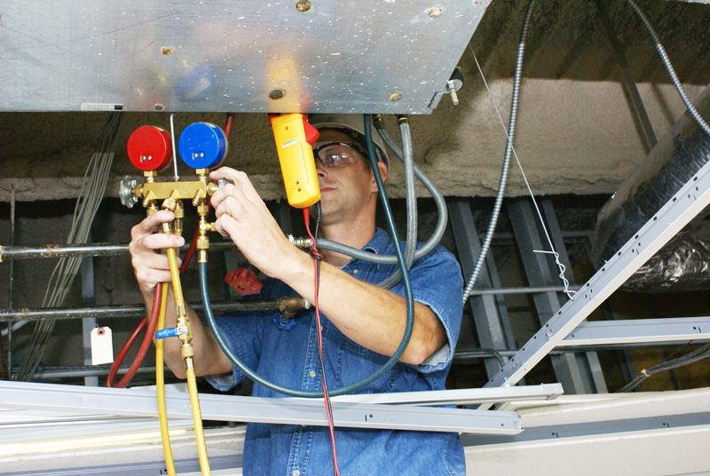 technician performing a test and balance