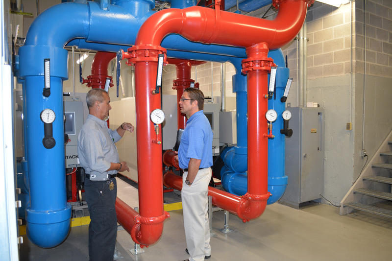 technician discussing building systems with client